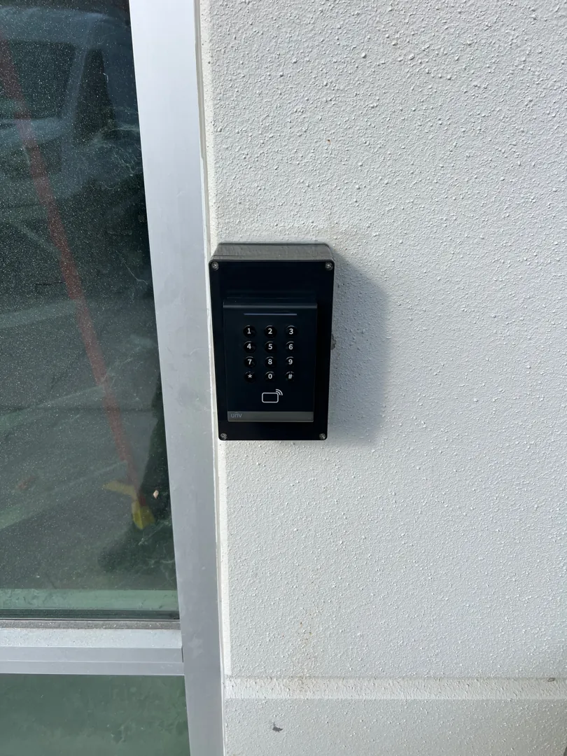 Keypad card reader installed beside an entry door at the Palmetto project