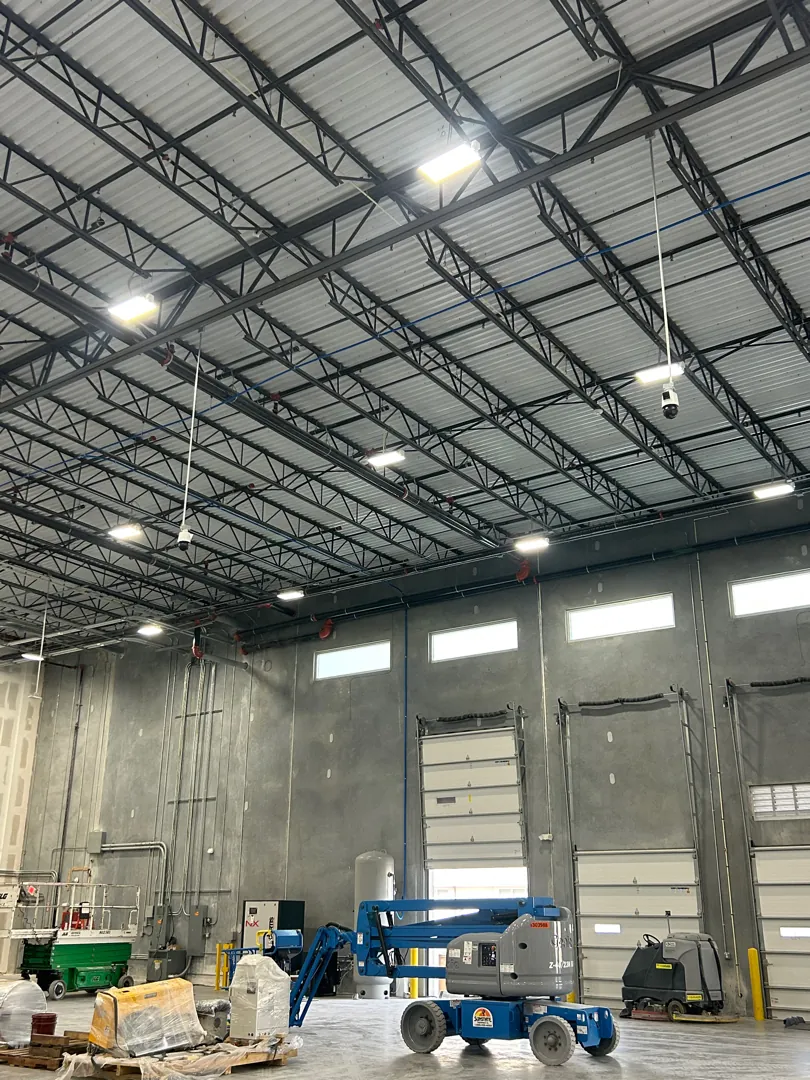 Warehouse interior with high-bay lighting and loading doors at the Palmetto project