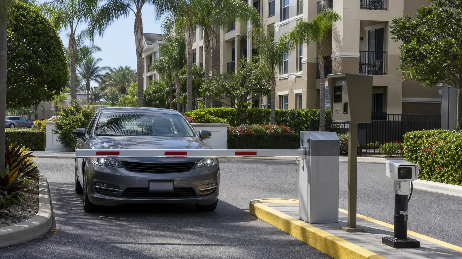 Vehicle approaching a Tampa condominium gate monitored by a license plate recognition camera